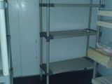 an image of a room with shelves and shelves in it