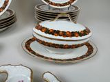 a lot of plates and bowls that are on a table