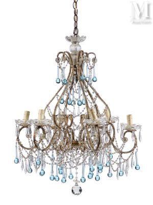 a close up of a chandelier with blue glass beads