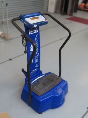 a blue machine that is sitting on the floor