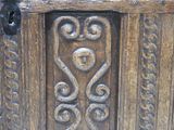 a close up of a wooden door with carvings on it