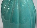 two vases that are sitting next to each other