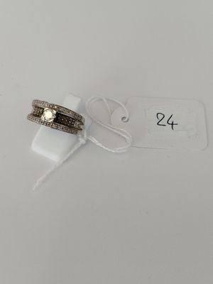 a couple of rings sitting on top of a white table