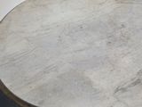 an image of a white marble table with a black base