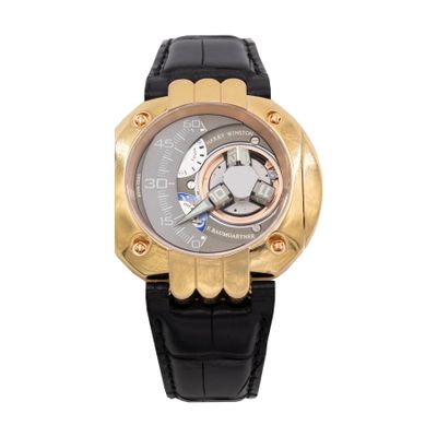 an image of a black and gold watch on a white background