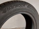 a close up of a tire on a white surface