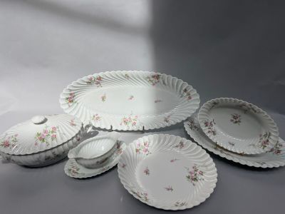 five plates and a bowl on the table