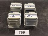 several stacks of cards are stacked on top of each other on a table