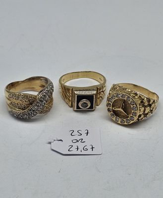 three gold rings with diamonds on them and a price tag