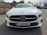 the front of a white mercedes cla parked in a parking lot