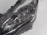 the headlight of a car is shown on a white surface