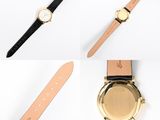 three different types of watches on a white surface with leather straps