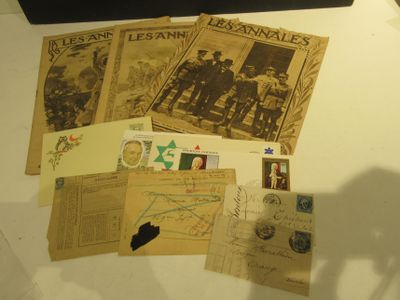 a black suitcase sitting on a table next to a bunch of old postcards