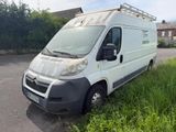 the van is parked on the side of the road in the grass
