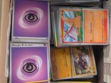 a lot of cards in a box on the floor