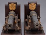 pair of antique cannon bookends on wooden bases