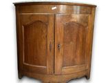 a wooden cabinet with a door and a drawer underneath it