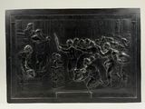 an image of a black relief of a group of people on a stage