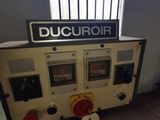 a machine that is sitting in a room with a window
