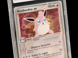 a close up of a pokemon card in a plastic case