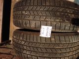 two tires are stacked on top of each other on the ground