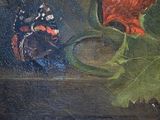 a painting of a red flower and a butterfly on a table