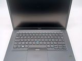 an open laptop computer sitting on top of a white table