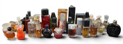 many different types of perfume bottles on a white surface