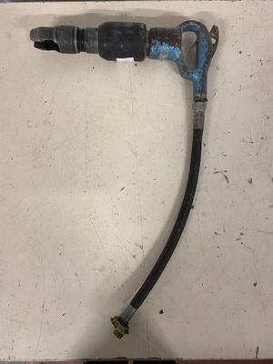 a close up of a hose attached to a wall with a hose attached to it