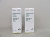 two bottles of mary cohr eye cream sitting on a table