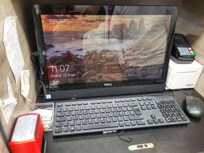 a laptop computer sitting on top of a desk