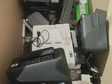 a box full of electronics and a printer on the floor