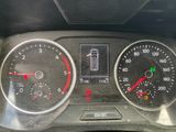 a close up of a car dashboard with various gauges