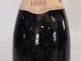 a bottle of wine that is sitting on a table