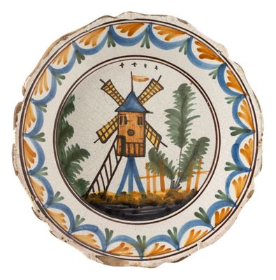a decorative plate with a windmill on it