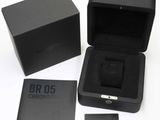 a black box with a black watch inside of it