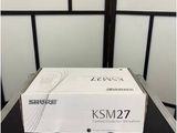 a white box with a remote on top of it