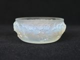 a close up of a glass bowl on a black surface