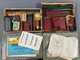 three boxes with various items in them sitting on a table