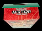 a box of one piece card game sitting on a table
