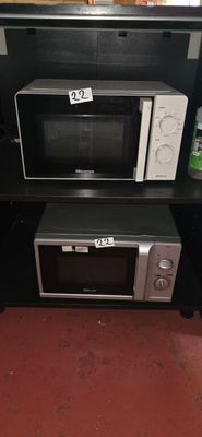 a microwave and a microwave oven on a black table