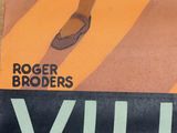 a poster of a man ' s legs and shoes on a table