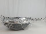 a bowl that is wrapped in plastic on a table