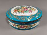 a blue and white box with a floral design on it