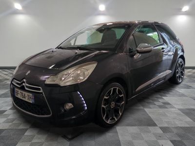 the black citrole is parked in the garage on a checkered floor