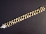 a close up of a bracelet on a black surface