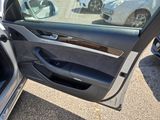 the door of a car is open with the driver ' s side door open