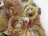 a pile of bracelets and bracelets on a table