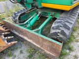 a tractor that is sitting in the dirt