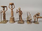 five figurines of people with a bowl on their head